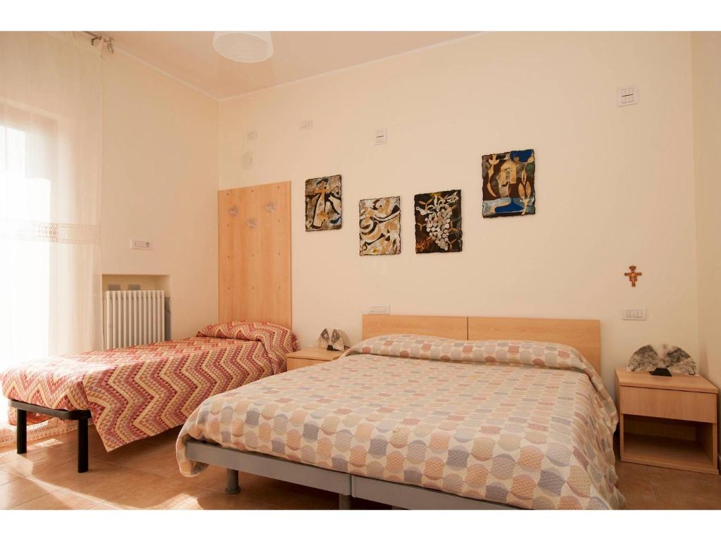 Postel nebo postele na pokoji v ubytování B&B & Residence Pozzo Misseo