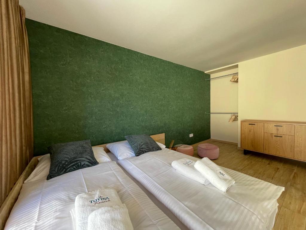 Postel nebo postele na pokoji v ubytování Totina Apartments