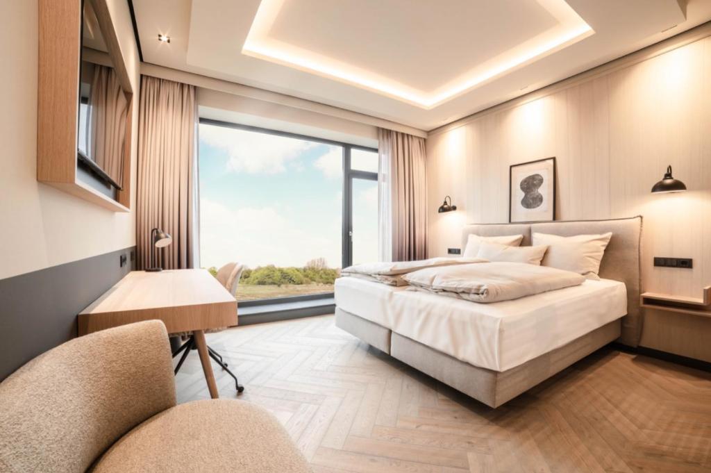 Postel nebo postele na pokoji v ubytování Fasson Hotel