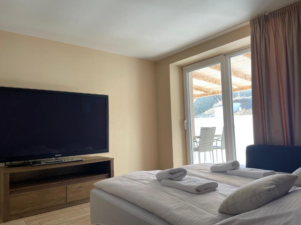 Postel nebo postele na pokoji v ubytování Totina Apartments
