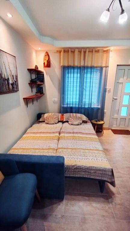 Postel nebo postele na pokoji v ubytování Apartments Aleksandra