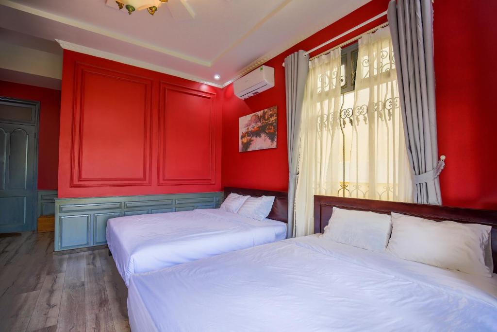 Giường trong phòng chung tại Thi Boutique Villa