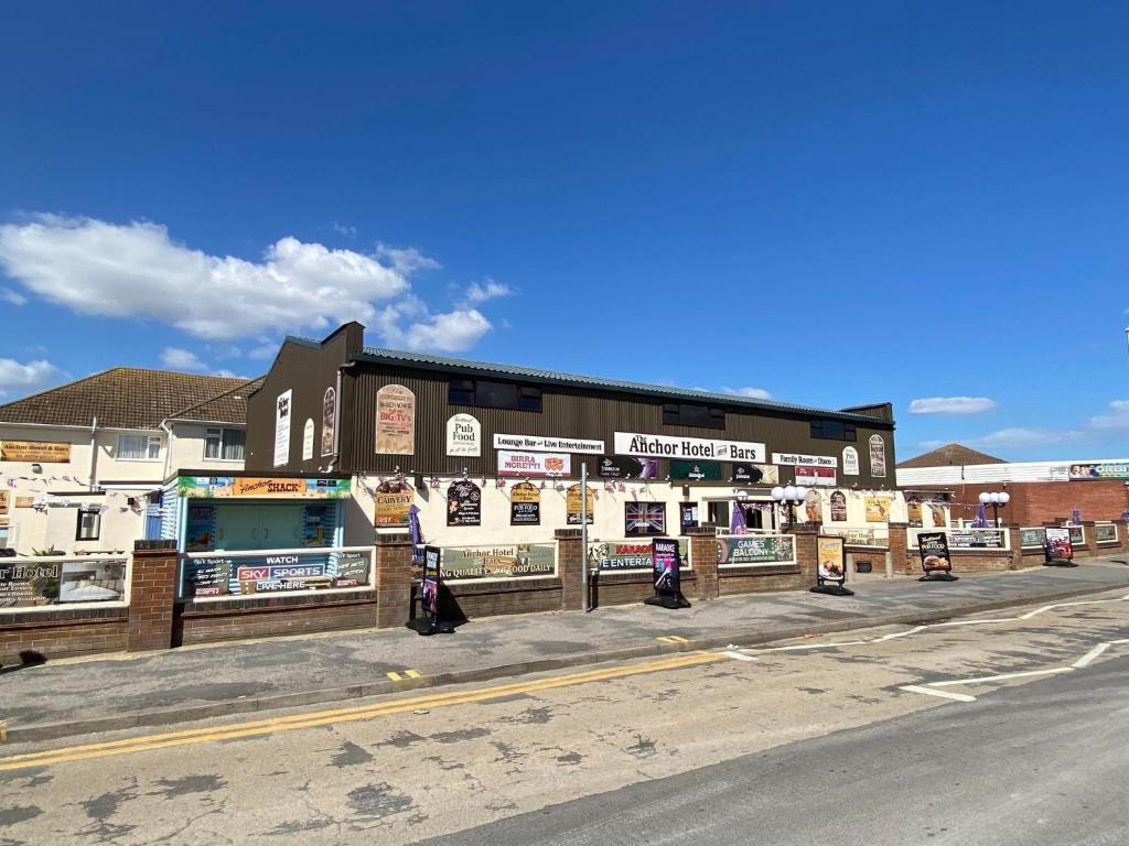 a building on the side of a street at The Anchor Hotel & Bars in Ingoldmells