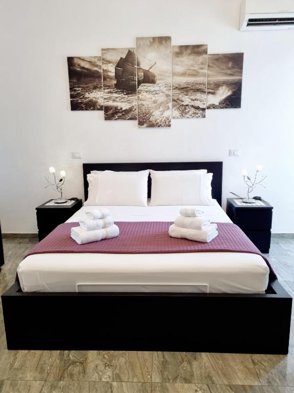 Postel nebo postele na pokoji v ubytování Albatros B&B Porto Cesareo