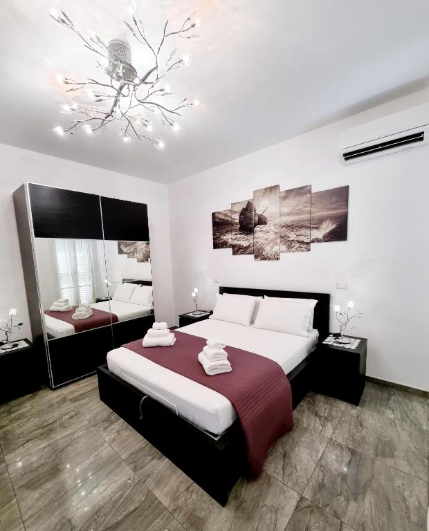 Postel nebo postele na pokoji v ubytování Albatros B&B Porto Cesareo