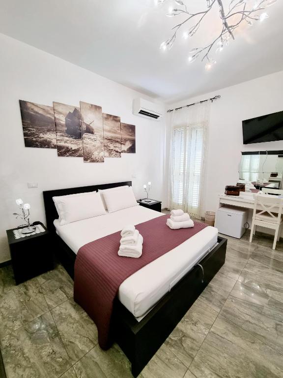 Postel nebo postele na pokoji v ubytování Albatros B&B Porto Cesareo