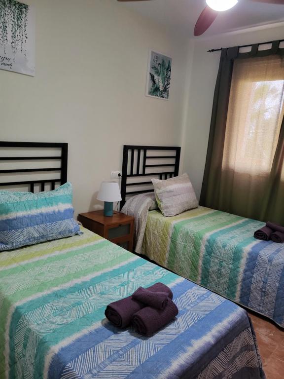 Posteľ alebo postele v izbe v ubytovaní ¡Apartamento cerca de la piscina en paraíso de Vera!