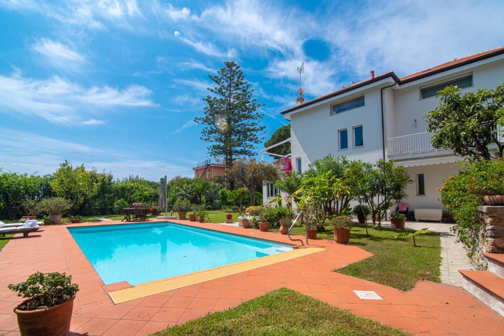a swimming pool in the backyard of a house at Magnificent Villa Sanremo in Sanremo