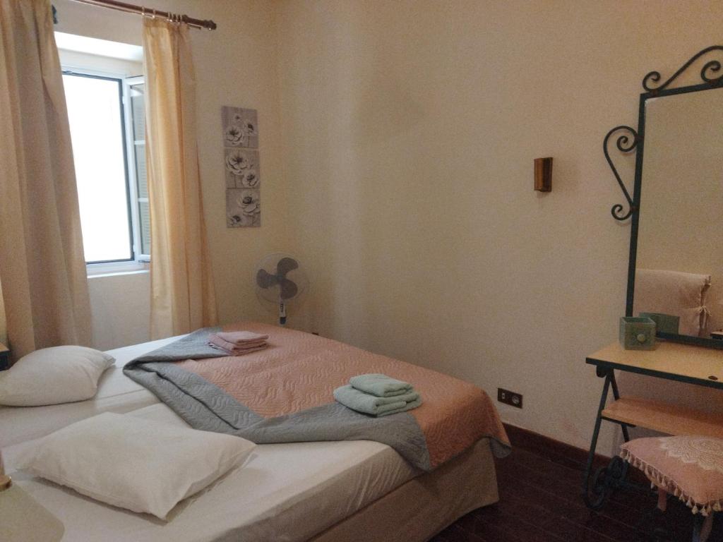 Ein Bett oder Betten in einem Zimmer der Unterkunft Casa di Cofineta Corfu old town