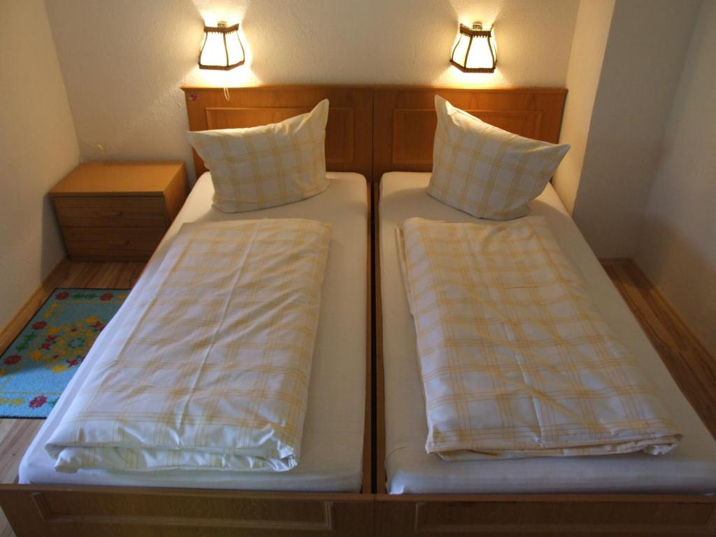 Postel nebo postele na pokoji v ubytování Gasthof Hauserwirt