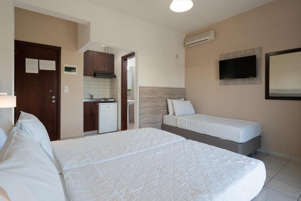 Postel nebo postele na pokoji v ubytování Hotel Grekas