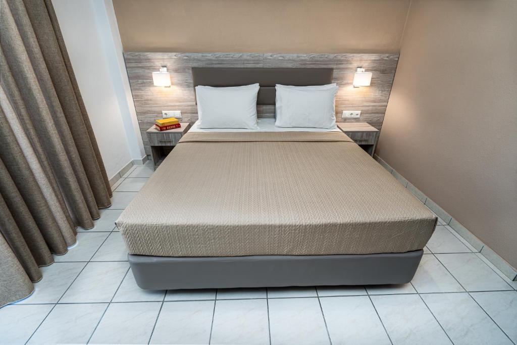 Postel nebo postele na pokoji v ubytování Hotel Grekas