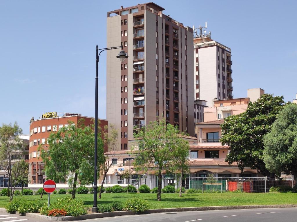a city with tall buildings and a stop sign at Seaside apartments Casa CARLA e Casa ANDREA in Olbia
