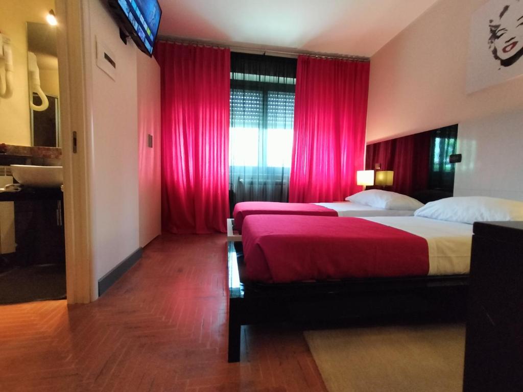 Postel nebo postele na pokoji v ubytování Hotel L' Orto degli Otelli