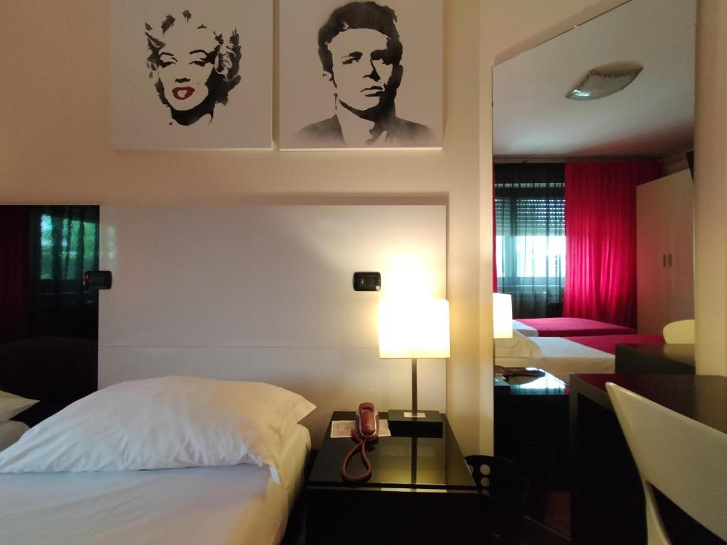 Postel nebo postele na pokoji v ubytování Hotel L' Orto degli Otelli