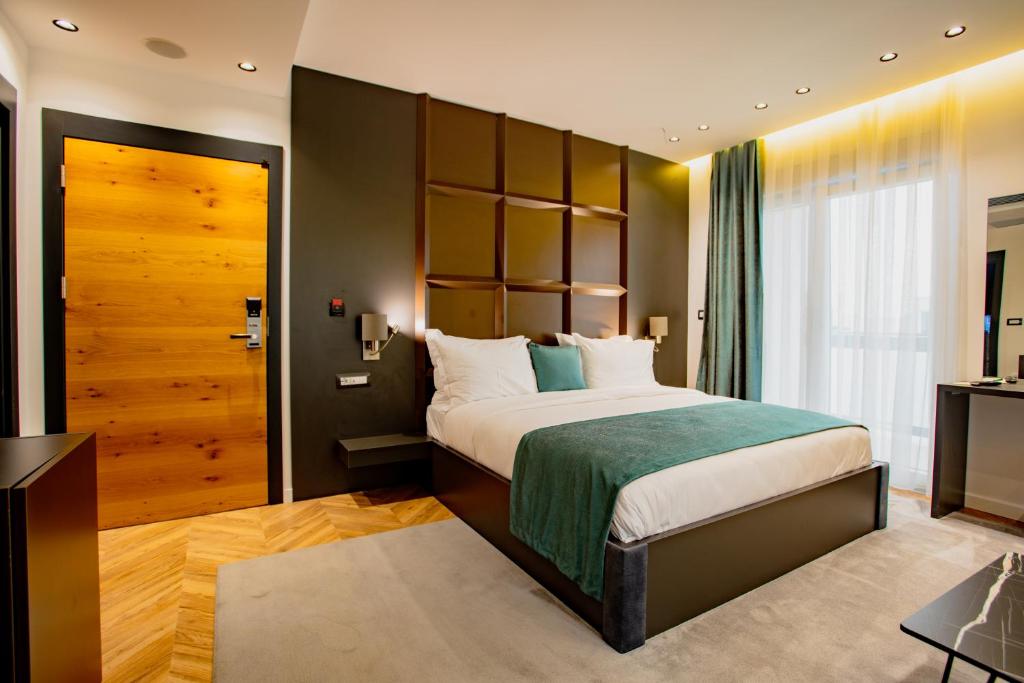 Postel nebo postele na pokoji v ubytování Ador Hotel