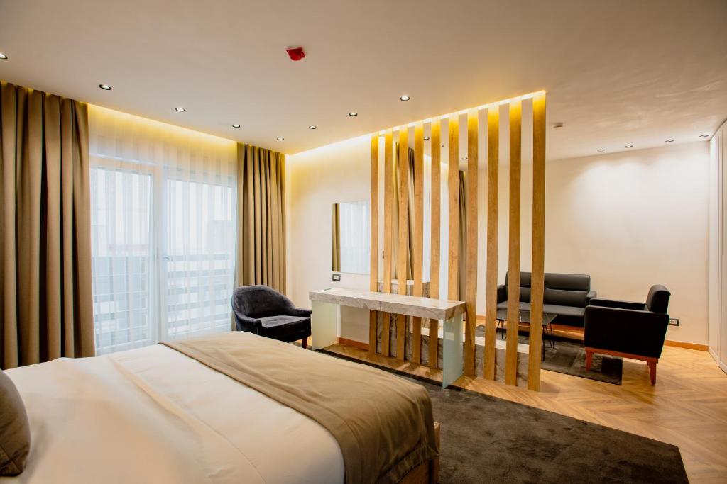 Postel nebo postele na pokoji v ubytování Ador Hotel