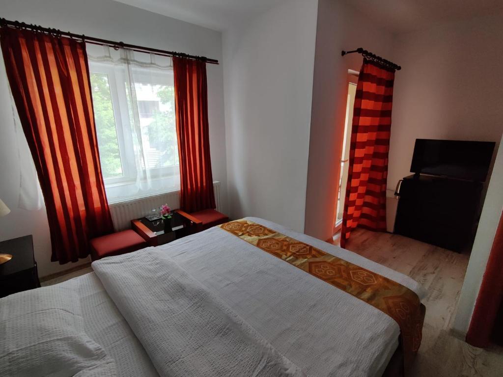 Postel nebo postele na pokoji v ubytování Pension Casa Samurai