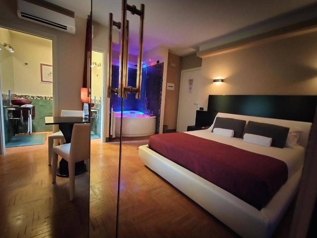 Postel nebo postele na pokoji v ubytování Hotel L' Orto degli Otelli