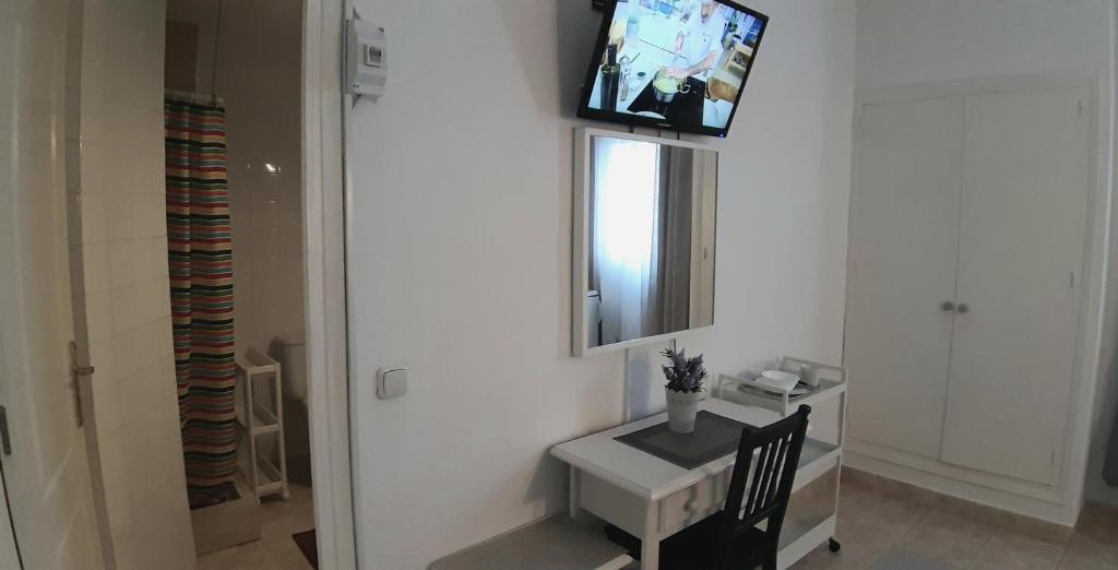 TV a/nebo společenská místnost v ubytování Hostal Nevada