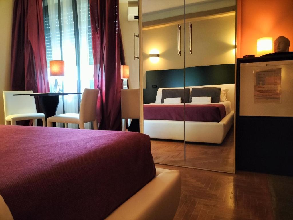 Tempat tidur dalam kamar di Hotel L' Orto degli Otelli
