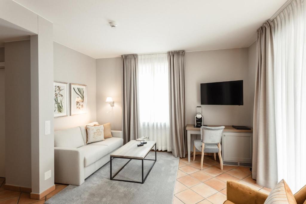 TV a/nebo společenská místnost v ubytování Hotel Ascovilla Charming Hideway