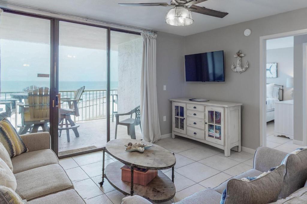 a living room with a couch and a table at Seaside Beach & Racquet Club 3602 in Orange Beach