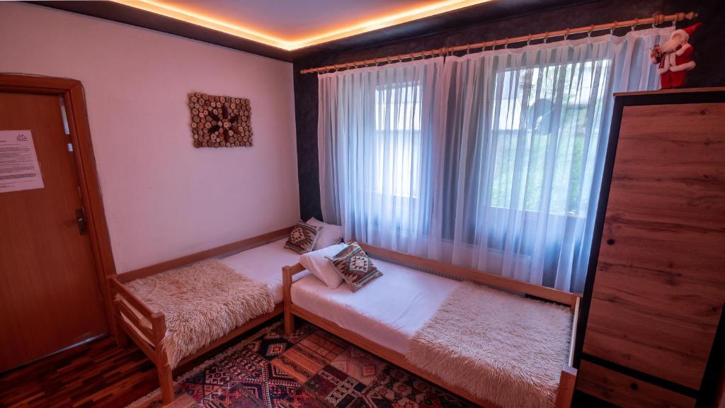 Postel nebo postele na pokoji v ubytování Alpin Apartments Vlašić