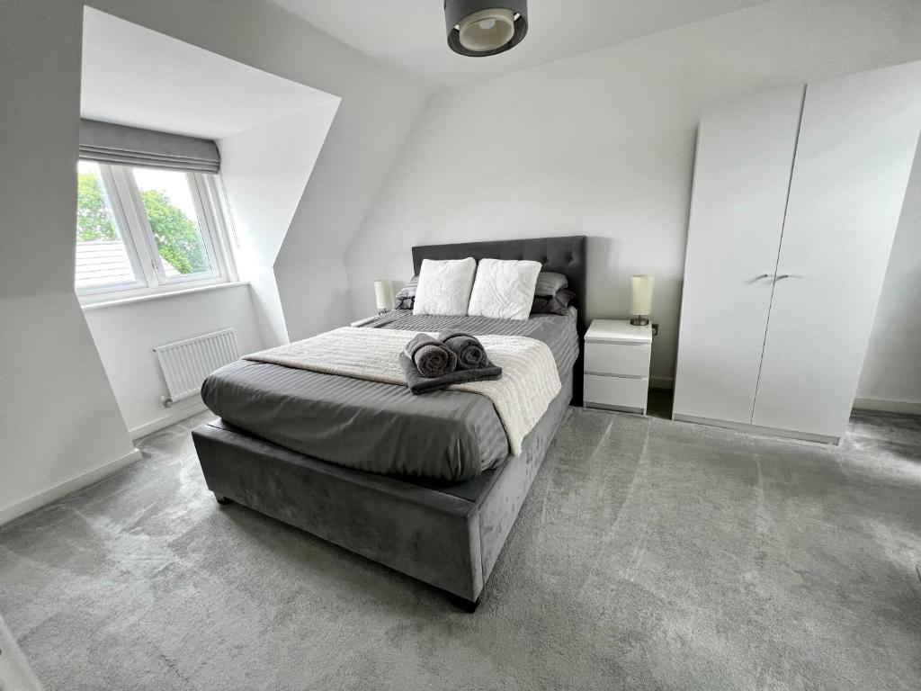 a bedroom with a large bed and a large window at North Colchester Homestay in Colchester
