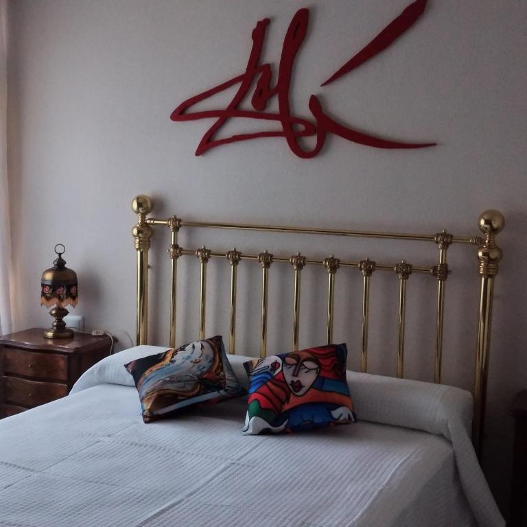 A bed or beds in a room at Casa rural Cal Fuster Experience