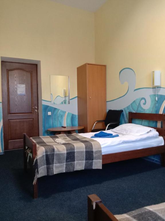 Postel nebo postele na pokoji v ubytování Mini-Hotel Ocean