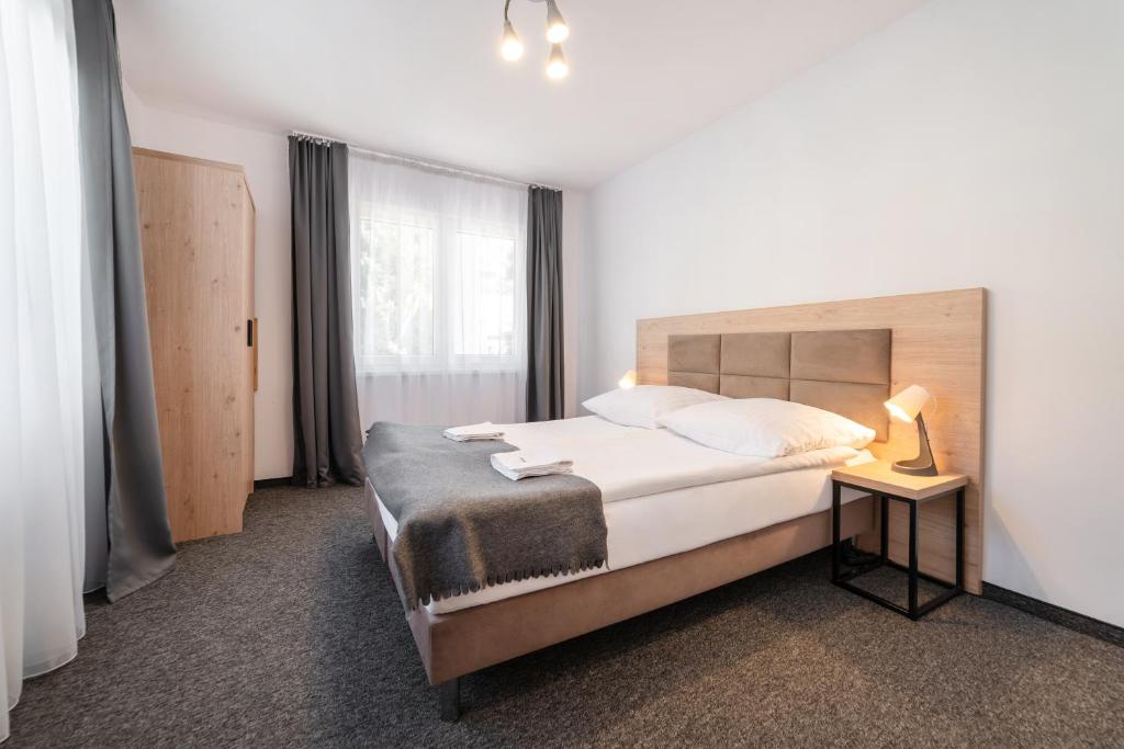 Postel nebo postele na pokoji v ubytování Dom Wczasowy Danusia
