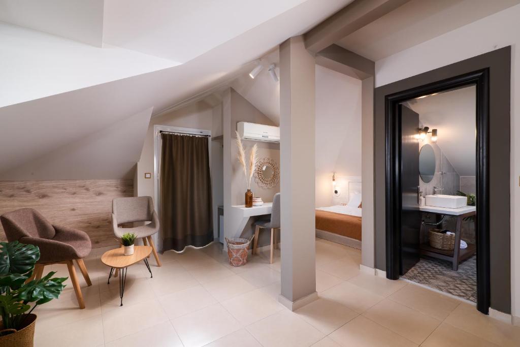 Postel nebo postele na pokoji v ubytování ELLE Rooms & Suites