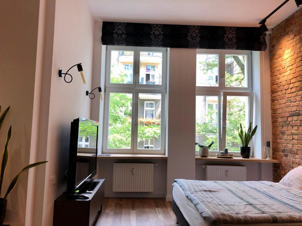 Televízia a/alebo spoločenská miestnosť v ubytovaní Apartament Centrum Superior