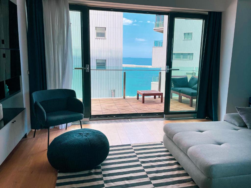 Beachfront Designer Apt, 100 sqm, 2-bath, huge terrace on the sea shore