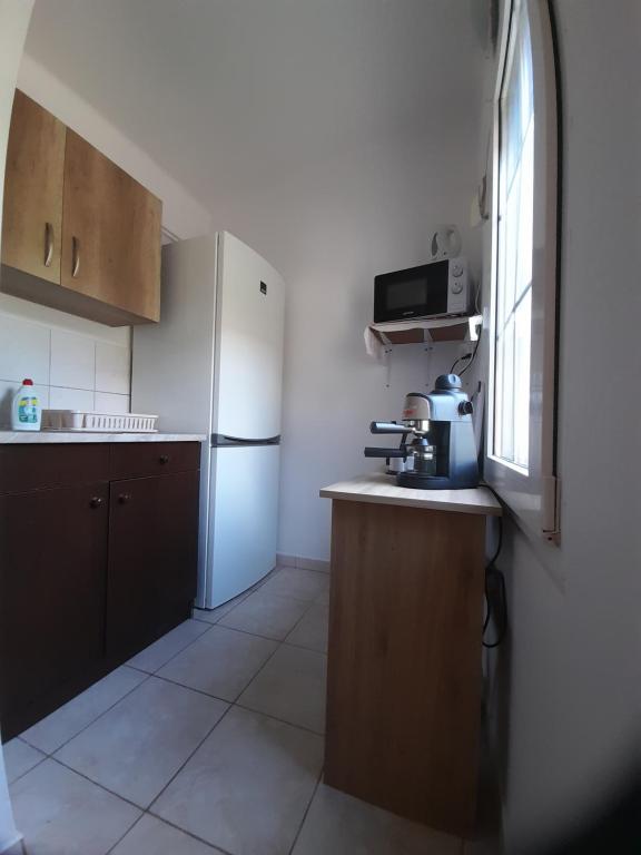 Kuchyňa alebo kuchynka v ubytovaní Lelle Lelke Apartmanház