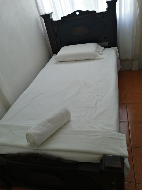 Postel nebo postele na pokoji v ubytování Casa Los Ángeles