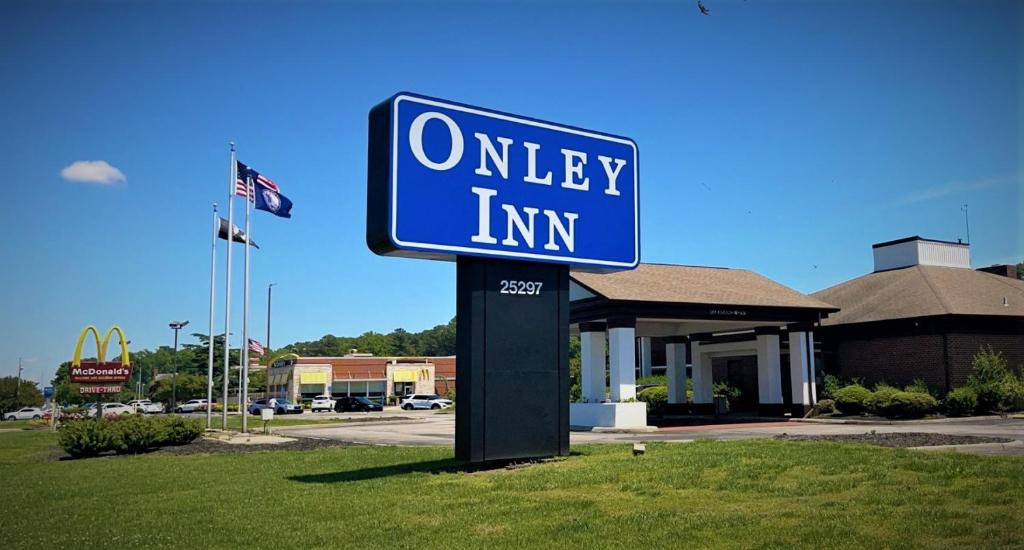 a blue street sign in front of a motel at Onley Inn in Onley