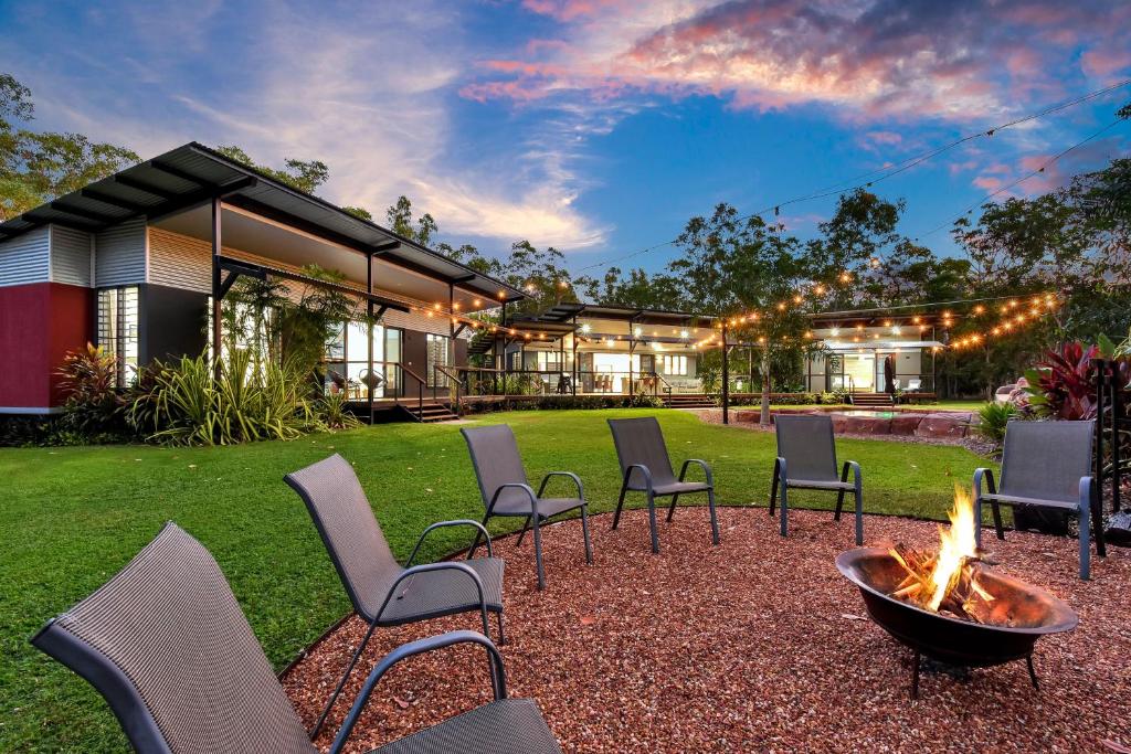 a group of chairs and a fire pit in a yard at 'Tropical Oasis - Darwin NT in Humpty Doo