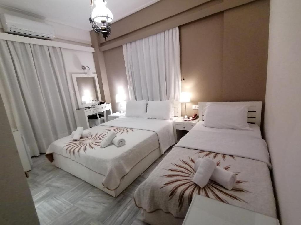 Postel nebo postele na pokoji v ubytování Hotel Galaxidi