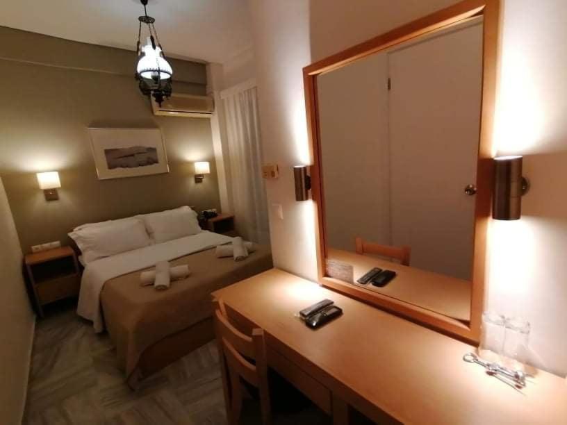 Postel nebo postele na pokoji v ubytování Hotel Galaxidi