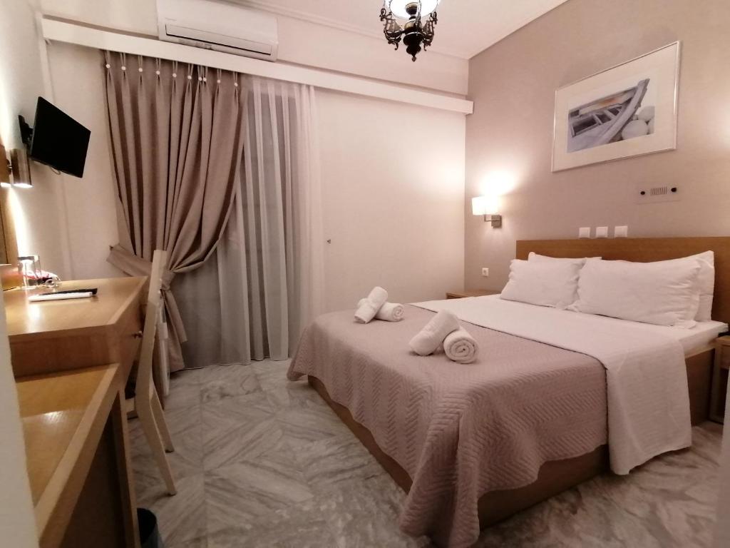 Postel nebo postele na pokoji v ubytování Hotel Galaxidi