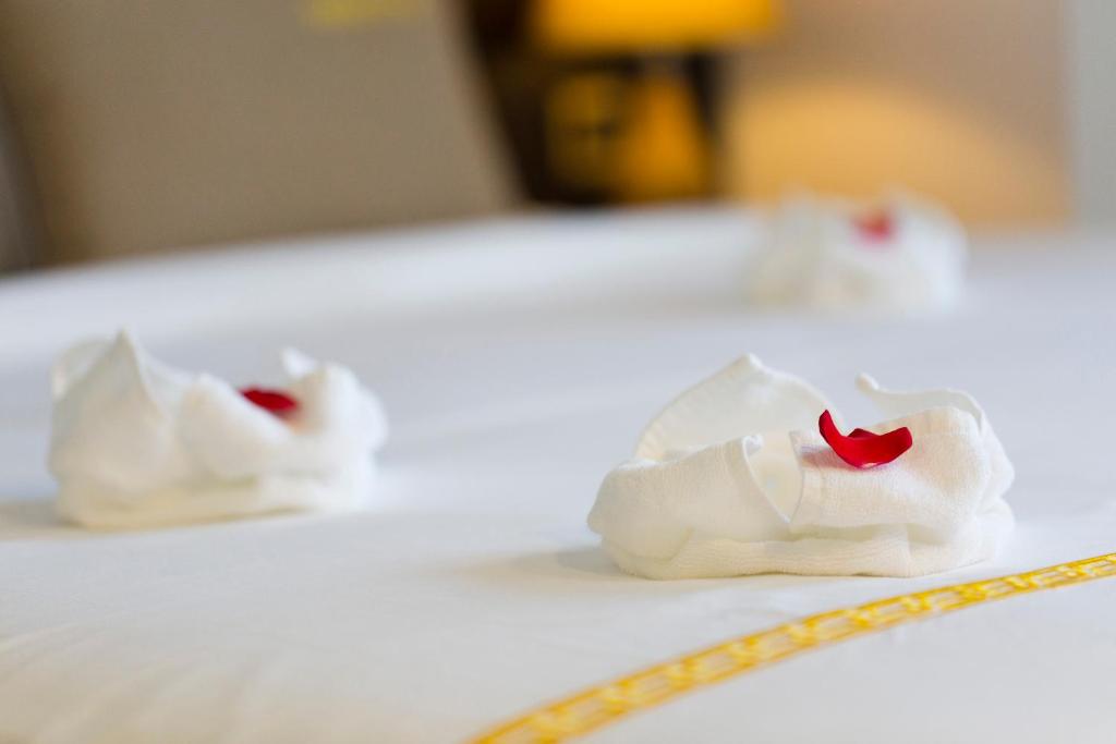Postel nebo postele na pokoji v ubytování Meriton Hotel Nha Trang
