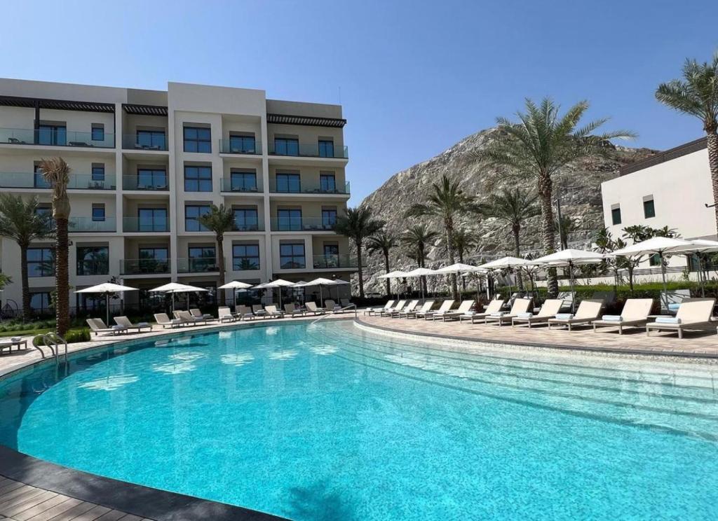 Bazén v ubytování Apartment Fujairah nebo v jeho okolí