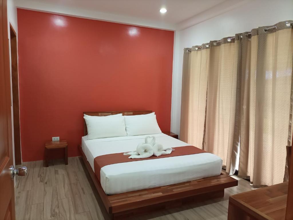 Postel nebo postele na pokoji v ubytování Portofino Panglao Bohol