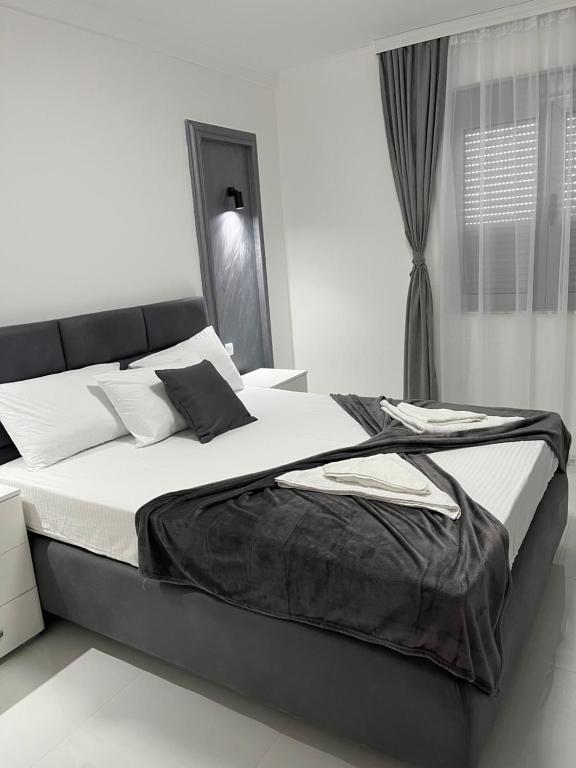 Postel nebo postele na pokoji v ubytování Apartments MASIMO