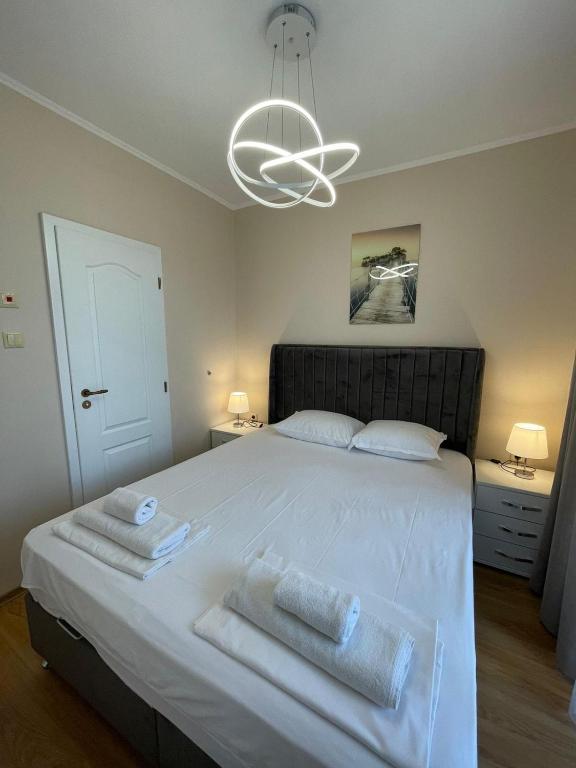 Postel nebo postele na pokoji v ubytování Izi Palace Deluxe StudioB1