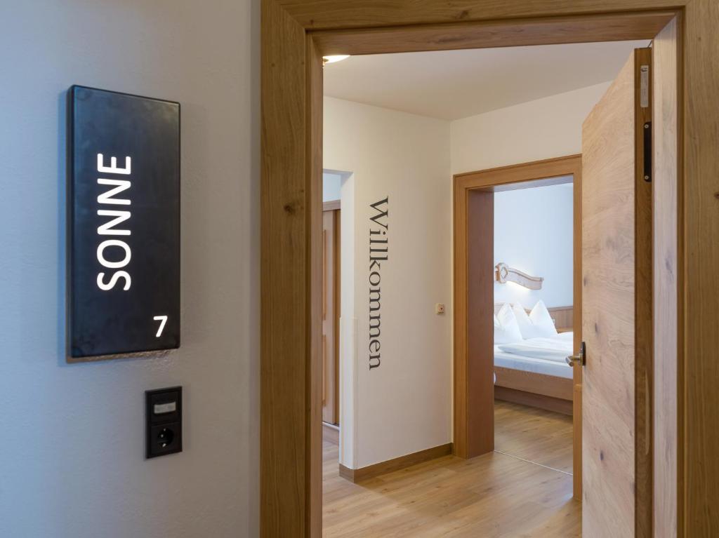 a hallway with a door leading to a bedroom at Appartements Schedererhaus in Going