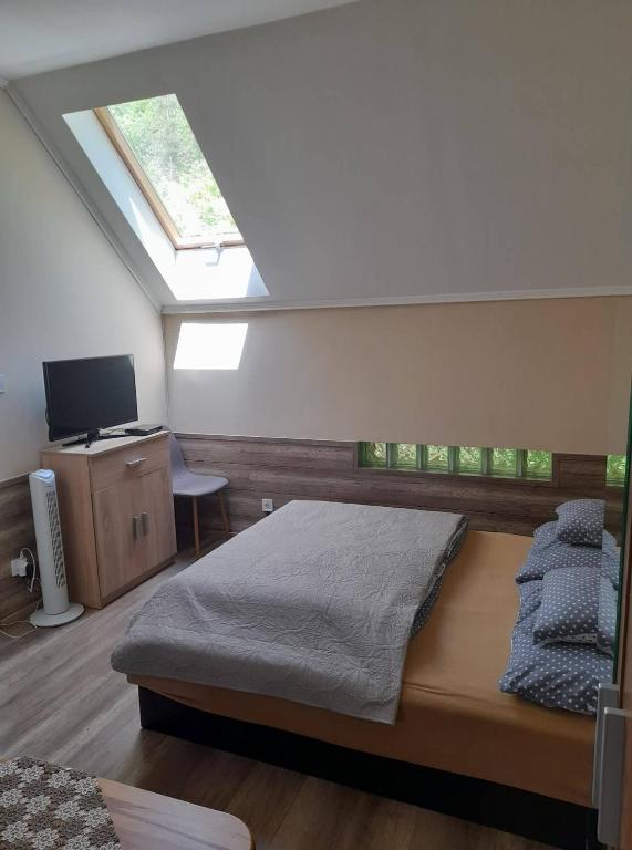 Postel nebo postele na pokoji v ubytování Fónagy Apartmanok