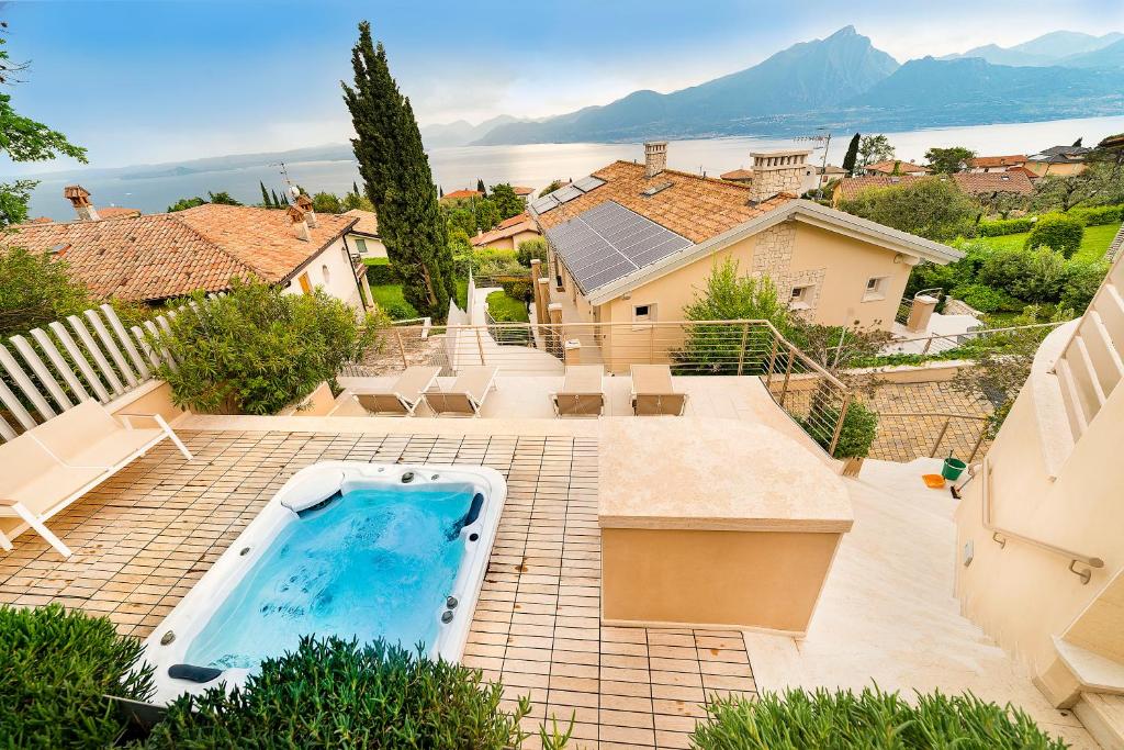 an aerial view of a house with a swimming pool at Villa Kiara in Torri del Benaco